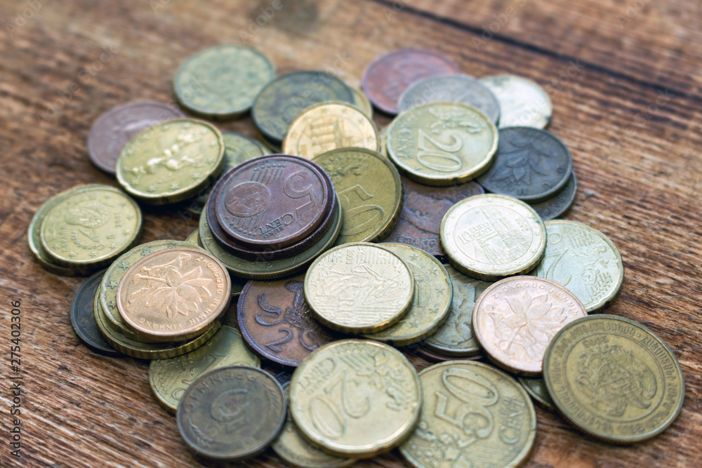 coins old rusty brass euro pile pack heap stack on a wooden background finance economy investment savings concept mock up selective focus close up coins old rusty brass euro pile pack heap stack on a wooden background finance economy investment savings concept mock up selective focus close up