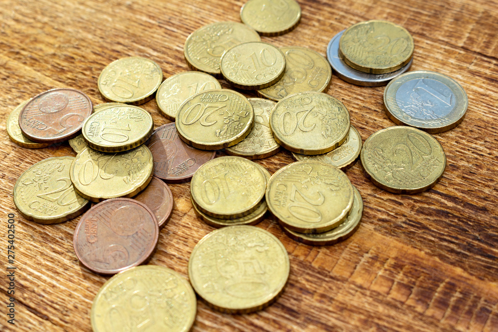 coins old rusty brass euro pile pack heap stack on a wooden background finance economy investment savings concept mock up selective focus close up coins old rusty brass euro pile pack heap stack on a wooden background finance economy investment savings concept mock up selective focus close up