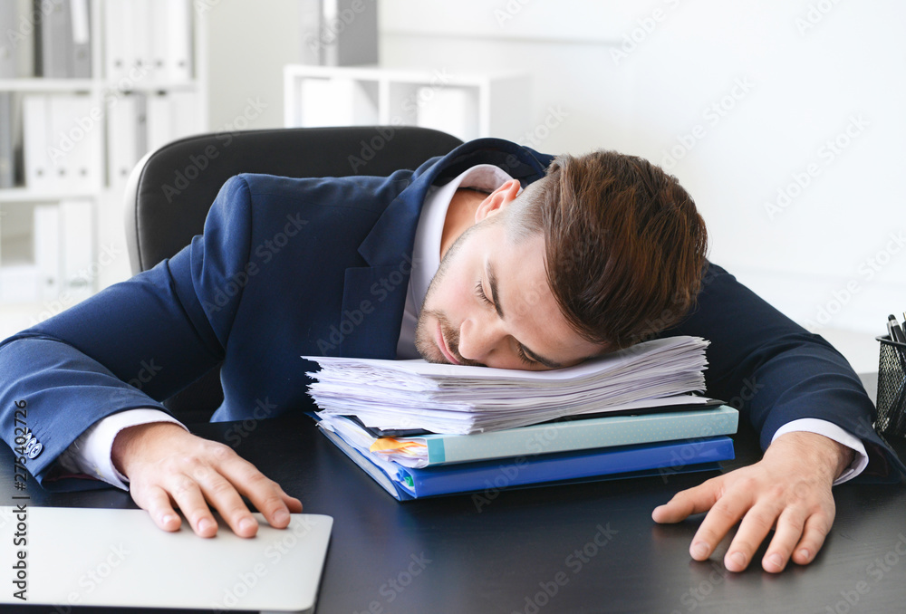 Tired businessman sleeping in office Tired businessman sleeping in office