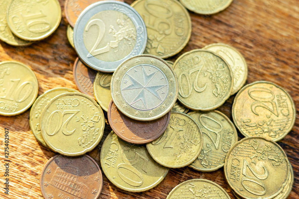 coins old rusty brass euro pile pack heap stack on a wooden background finance economy investment savings concept mock up selective focus close up coins old rusty brass euro pile pack heap stack on a wooden background finance economy investment savings concept mock up selective focus close up