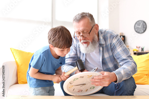 Grandfather teaching little...