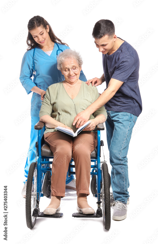 Young caregiver with senior woman and her grandson on white background Young caregiver with senior woman and her grandson on white background