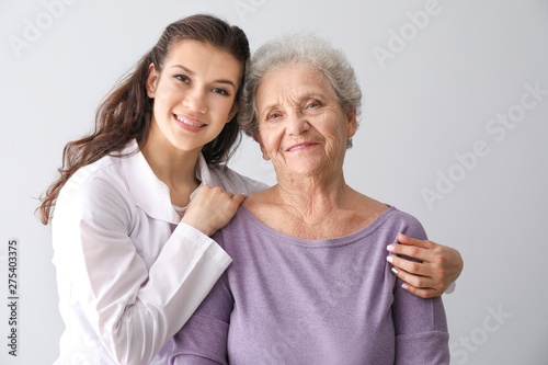 Young doctor with senior wo...