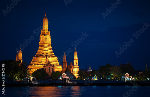 View of beautiful Wat Arun Rajvararam or Wat Arun or Wat Makok at waterfront of the Chao Phraya River in night Which is historical significance and famous tourist destination of Bangkok Thailand.