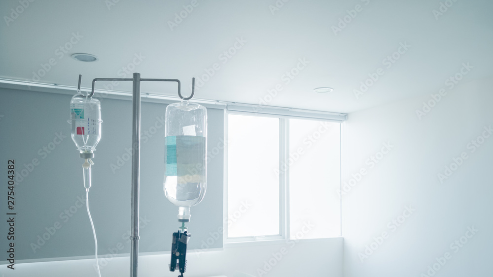 Hanging pillar and Saline solution fluid iv bag in emergency room at  hospital.right copy space Stock Photo