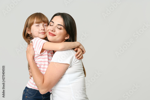 Portrait of happy mother an...