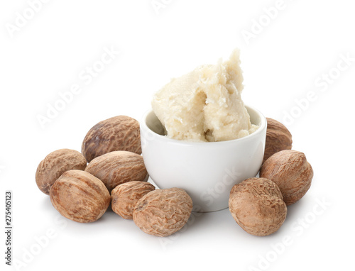 Bowl with shea butter on white background