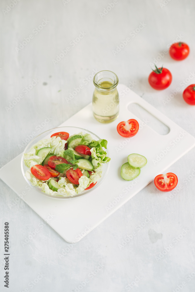 Vegetable mix salad in a bowl on kitchen table Vegetable mix salad in a bowl on kitchen table