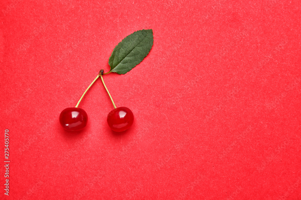 Tasty ripe cherry on color background Tasty ripe cherry on color background