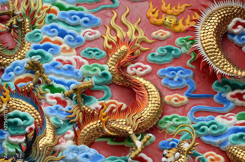 Chinese dragon in the wall according to Buddhist temples © pongpol