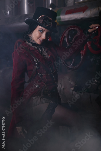 Portrait of a young steampunk woman shrouded in steam