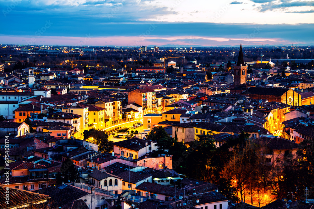 Aerial view of famous touristic city Verona in Italy at sunset. Bright sky