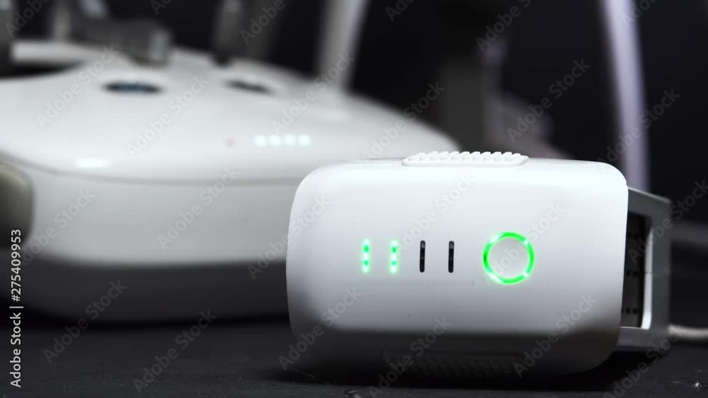 Close-up Of The Drone's Charger Is Charging A Flashing Green Lights Close-up Of The Drone's Charger Is Charging A Flashing Green Lights