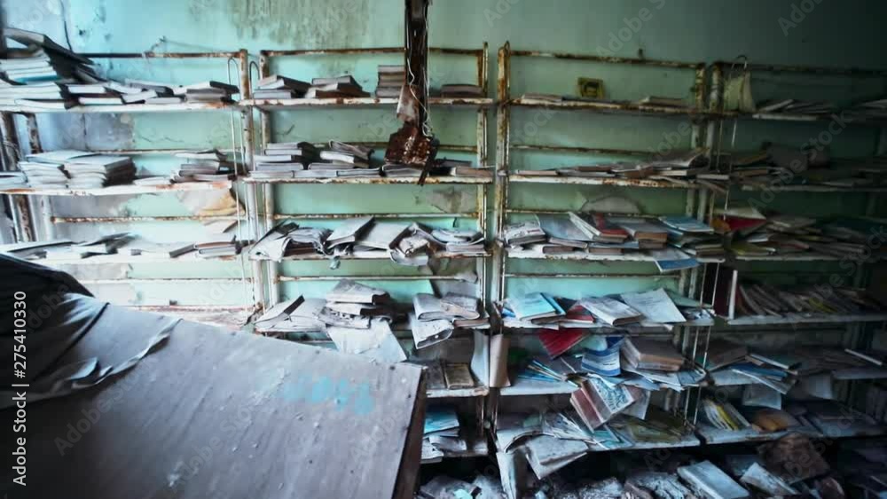 View inside old abandoned library with lots of books in high radiation ...
