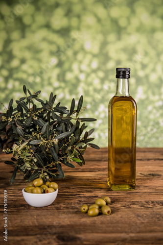Fototapeta Naklejka Na Ścianę i Meble -  Olive oil, olive tree and green olives, bottles of olive oil.