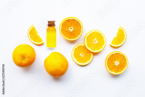 Orange fruits with citrus oil. Natural vitamin C on white background.