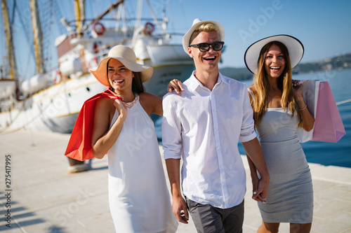 Happy young friends on luxury vacation. Travel, shopping, fun, friends concept © NDABCREATIVITY