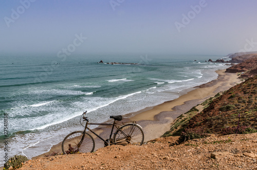 Africa Morocco vintage bike on a hillside on the shores of the Atlantic Ocean