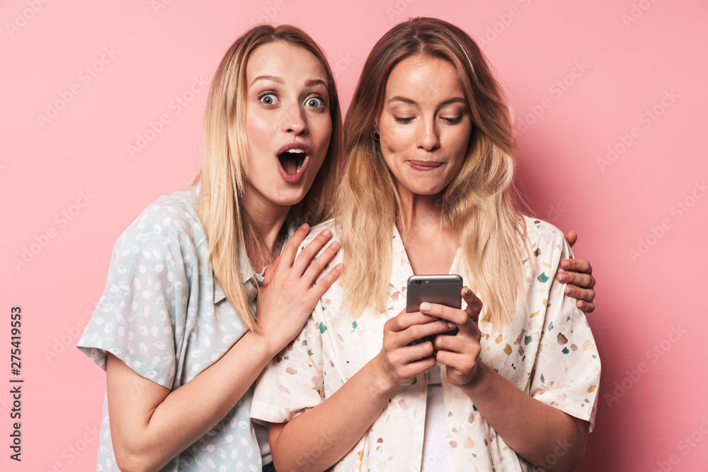 Two attractive blonde girls wearing summer outfit Two attractive blonde girls wearing summer outfit