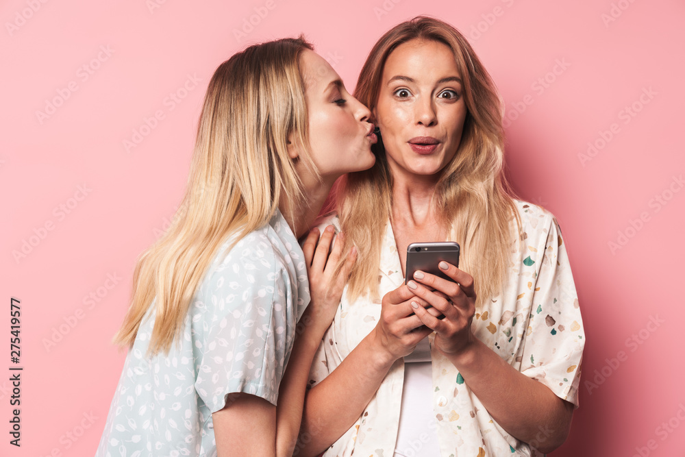 Two attractive blonde girls wearing summer outfit Two attractive blonde girls wearing summer outfit