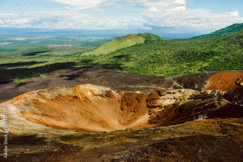Nicaragua. Cerro Negro. View from volcanoes. Juicy greens, blue sky, brown earth.
