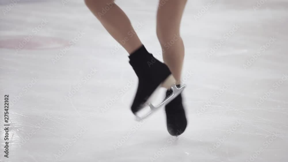 Figure skating, ice skating training. Feet skater on the ice, close-up, Figure skating, ice skating training. Feet skater on the ice, close-up,