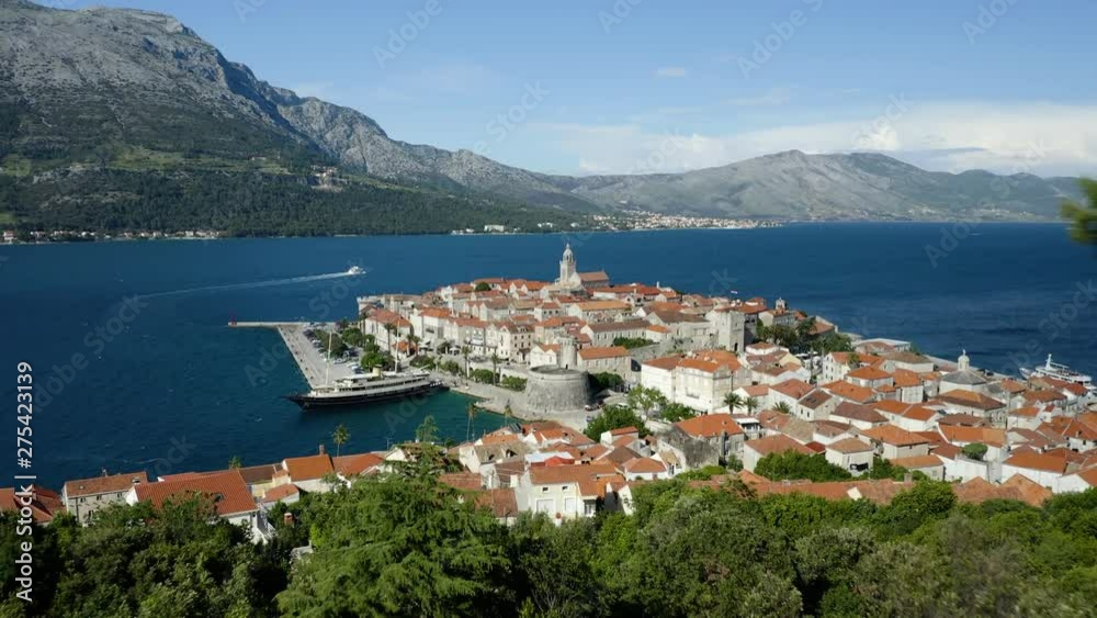 Korcula island old town framed by environment, push forward revealing beautiful coastal region of Croatia