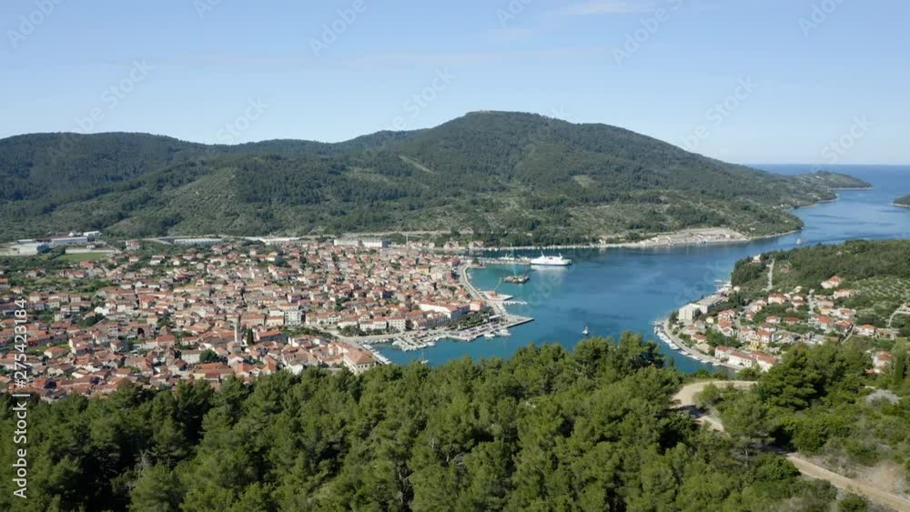 Aerial push revealing Korcula Island town of Vela Luka, beautiful warm day on coastal Adriatic Sea Aerial push revealing Korcula Island town of Vela Luka, beautiful warm day on coastal Adriatic Sea