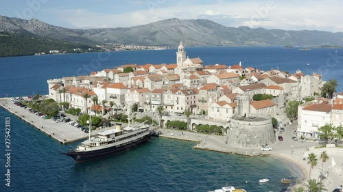 Wallpaper Mural Korcula Old town and fort, Aerial pan of Croatian picturesque getaway with luxury yacht in harbor 4k Torontodigital.ca