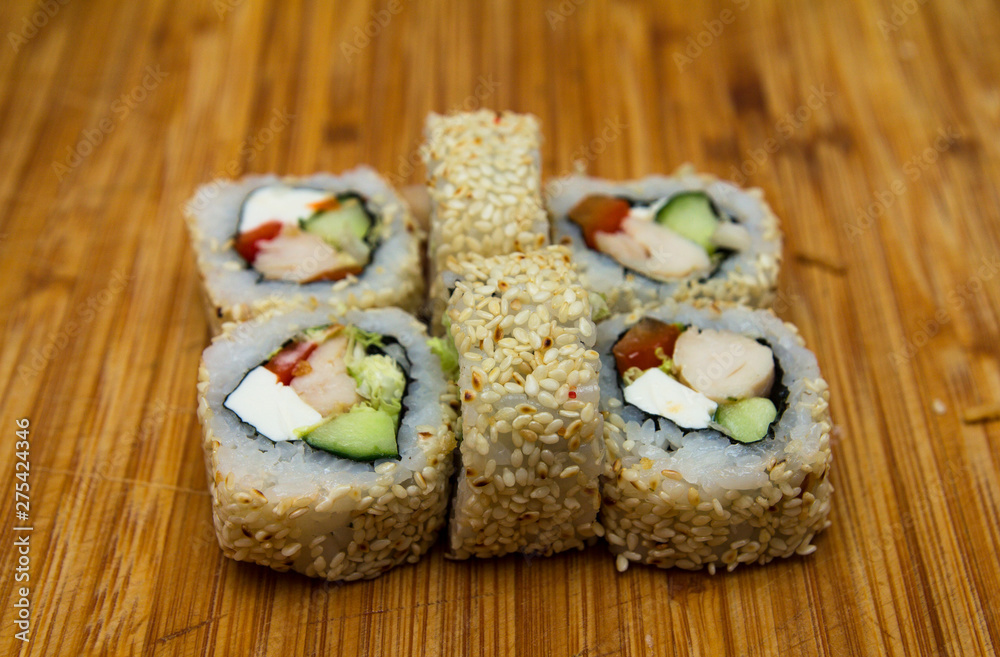 Sushi on a wooden tray. Japanese sushi. Sushi on a wooden tray. Japanese sushi.