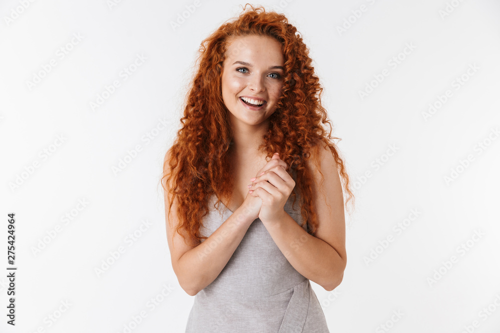 Portrait of an attractive woman with long curly red hair Portrait of an attractive woman with long curly red hair