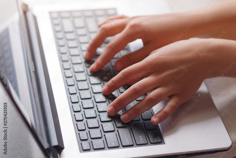Woman working at home office hand on keyboard close up Woman working at home office hand on keyboard close up