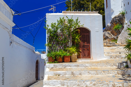 Fototapeta Naklejka Na Ścianę i Meble -  Facade of traditional white house in Lindos town at Rhodes island