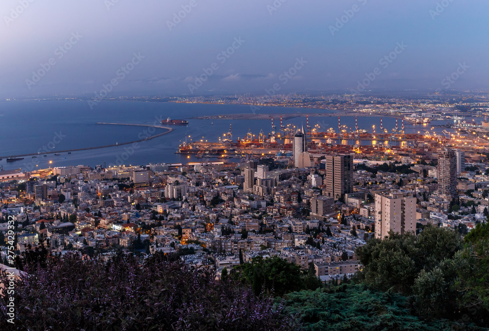 Sunset view from the Mount Carmel to the downtown and port of Haifa city in Israel