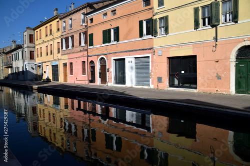 Ancient lagoon houses on the canal in the town of Comacchio - Italy