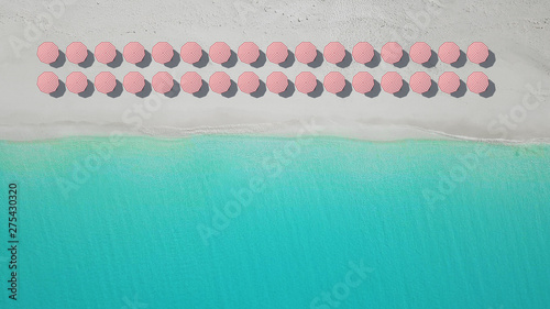 aerial top view on the beach with lots of beach umbrella.
