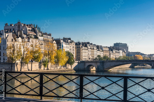 France, Paris, 4th arrondissement, île Saint-Louis, buildings of the Quai d'Orleans, seen from the Pont de l'Archevêche and the Pont de la Tournelle in the background photo