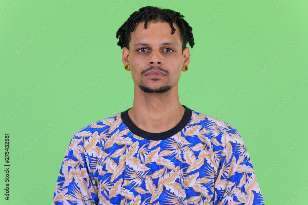 Face of young handsome African man with dreadlocks Face of young handsome African man with dreadlocks