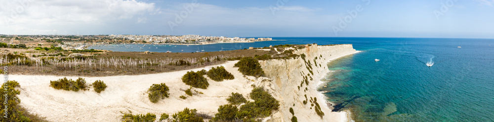 Big panorama of St Thomas bay, Munxar path near Marsaskala, Malta. Famous trekking path Marsaskala-Marsaxlokk