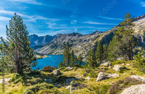 France, Hautes-Pyrenees, Haute Vallee d'Aure, Neouvielle National Nature Reserve, the Aubert lake seen from La Hourquette d'Aubert pathway photo