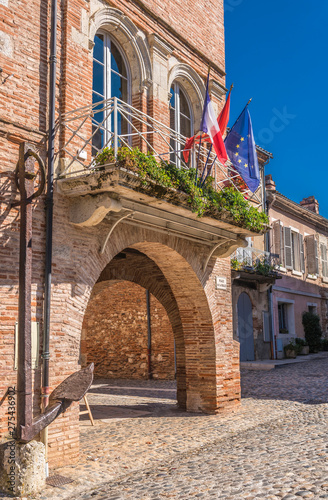 France, Tarn-et-Garonne, Auvillar, Place de la Halle (17th-18th century) anchor from the 17th century and City hall (Most Beautiful Village in France) Saint James way photo