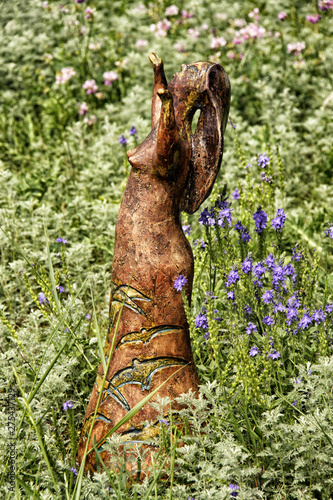 Small ceramic statue of the lady in meadow © ondrejschaumann