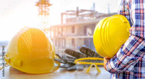 Wallpaper Mural Safety yellow helmet on construction site background, Torontodigital.ca