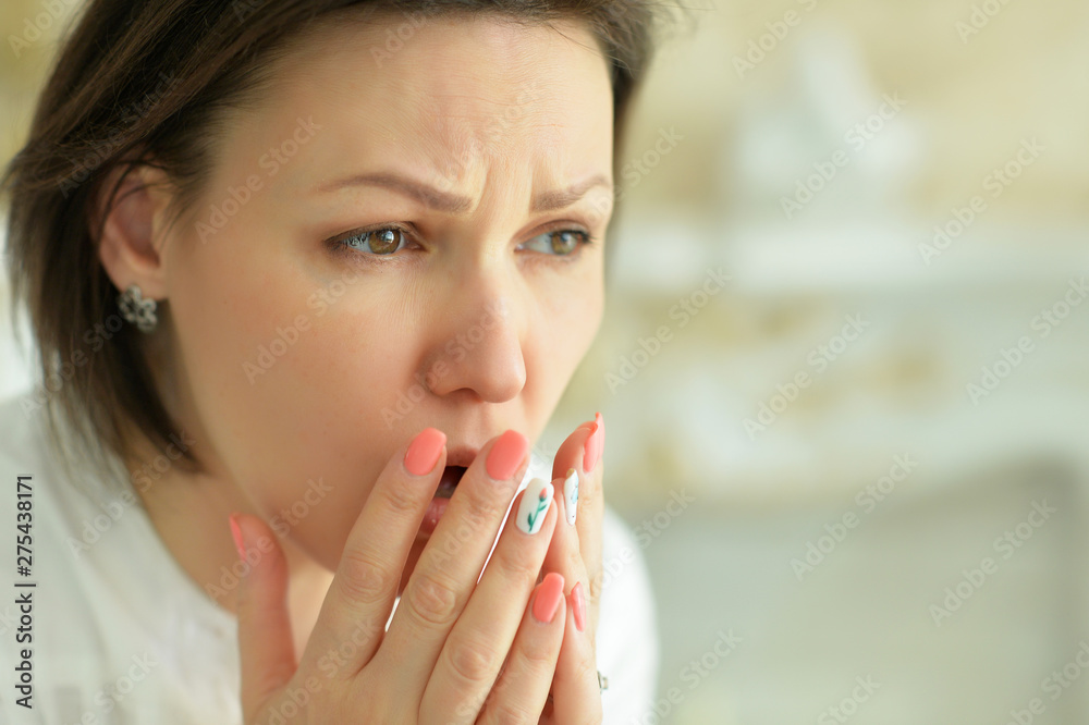 Close up portrait of sad young woman posing at home Close up portrait of sad young woman posing at home
