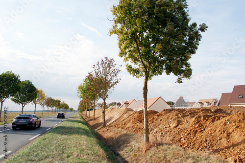 Seine et Marne. Housing development under construction. Construction of an anti-noise hillock to protect the houses from the noise of the departmental road.