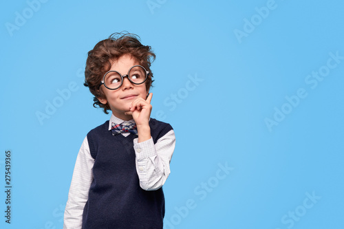 Fotografie Thoughtful schoolboy looking away