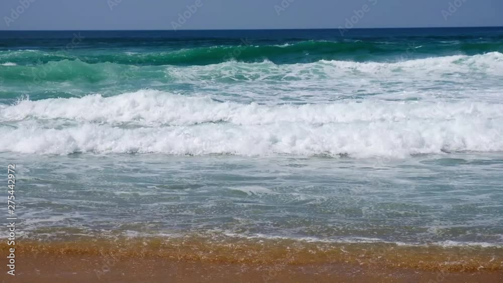 Tropical beach aerial view, Top view of waves break on tropical white sand beach. Sea waves seamless loop on the beautiful sand beach. Tropical beach aerial view, Top view of waves break on tropical white sand beach. Sea waves seamless loop on the beautiful sand beach.