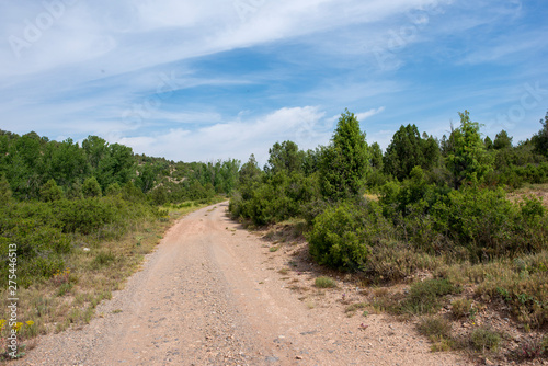 Rural road between mountains of the Sierra de Gudar, Valbona