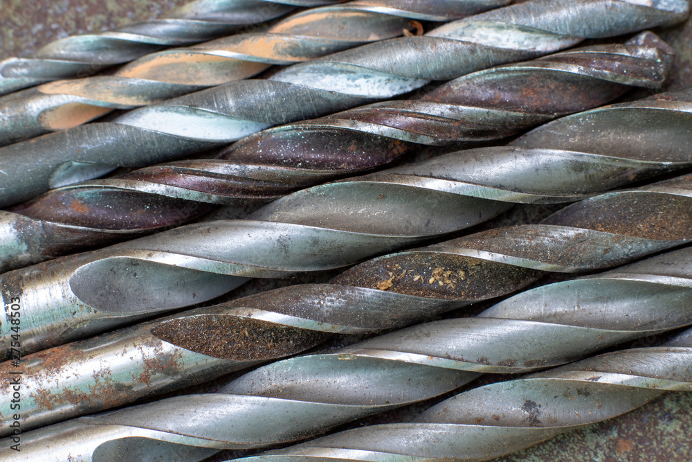 Fototapeta premium old drills lie in a row, background