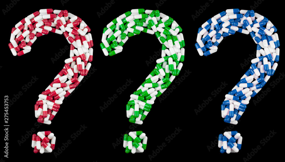 question mark written in blue green red and white medical capsules, isolated on a black background question mark written in blue green red and white medical capsules, isolated on a black background